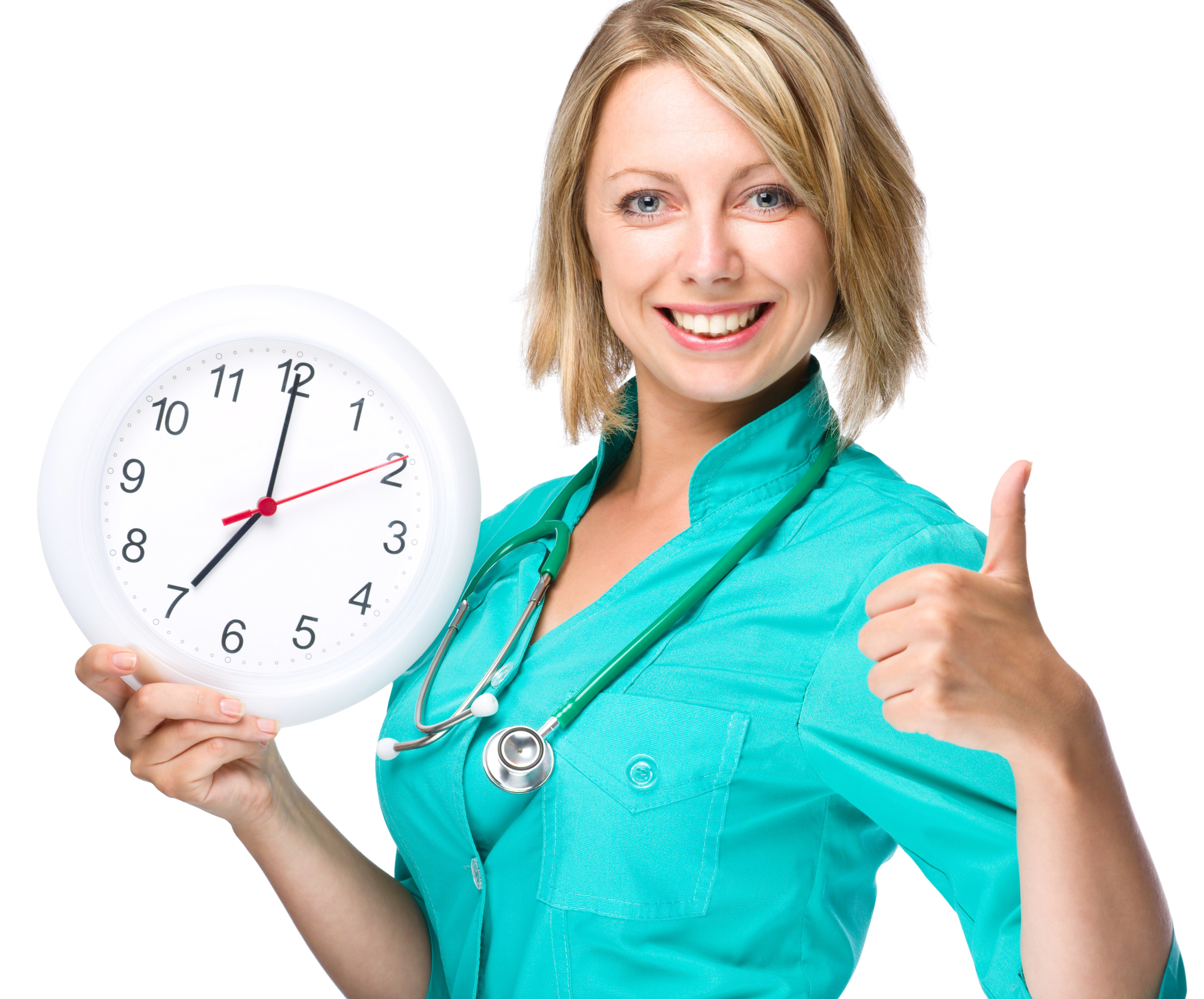 A woman in medical attire holds a wall clock showing 10:10 and gives a thumbs up, smiling at the camera.