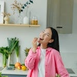 A Woman Eating Vegetables